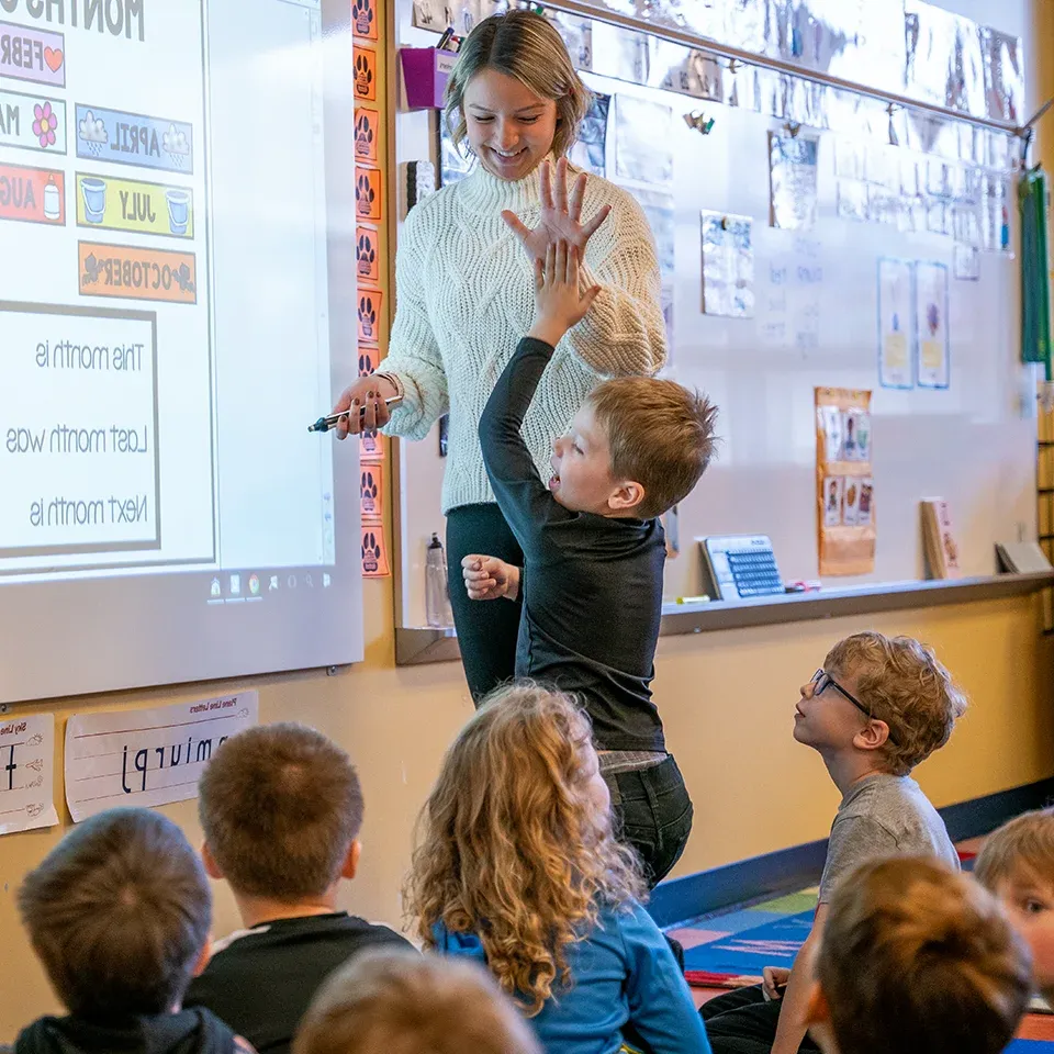 BW student teacher in classroom with young children